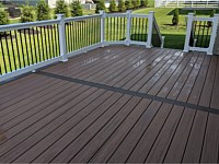 <b>Trex Transcend Tiki Torch Deck Boards-Spiced Rum Feature Board with White Washington Vinyl Railing and Black Aluminum Balusters in Gambrills MD</b>